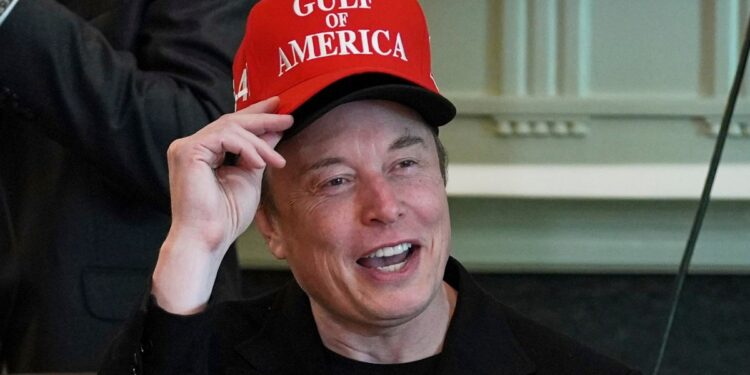 Musk Turns Heads With Double Hat at Trump Meeting