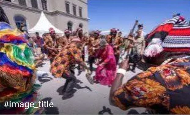 ‎Okonjo-Iweala Dances with Igbo Masquerades at WTO Open Day in Switzerland ‎